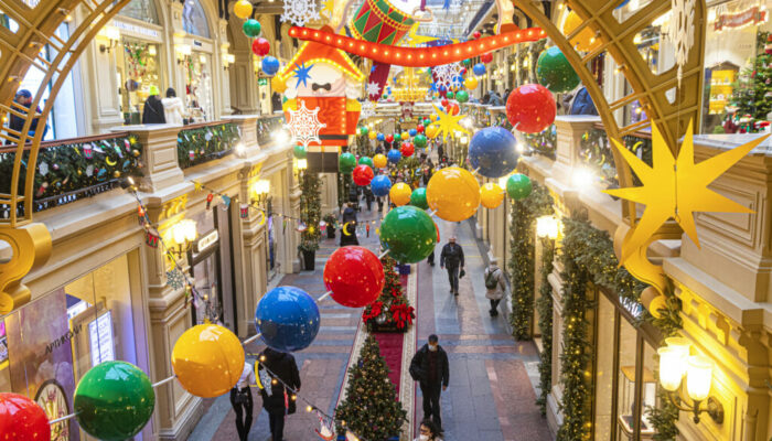Moscow, Russia, 12.15.2021. Christmas decoration in GUM, a store in the center of Moscow made of garlands of colorful balloons, stars, snowflakes, lined up in a row of decorated Christmas trees